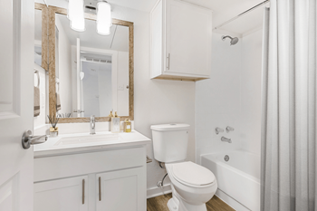 White quartz counters in kitchen and bath